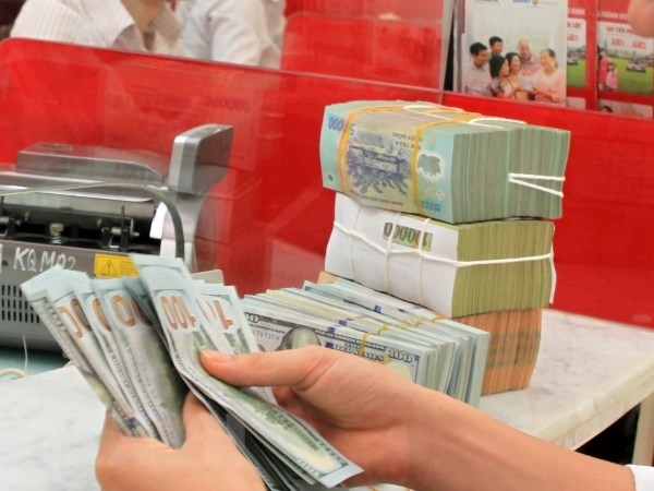 Ảnh minh họa: TTXVN Sáng 12-11, tỷ giá trung tâm giữa đồng Việt Nam và đô la Mỹ tăng 10 đồng