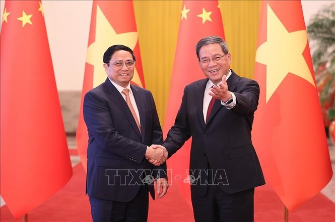 Thủ tướng Trung Quốc Lý Cường đón Thủ tướng Phạm Minh Chính. 