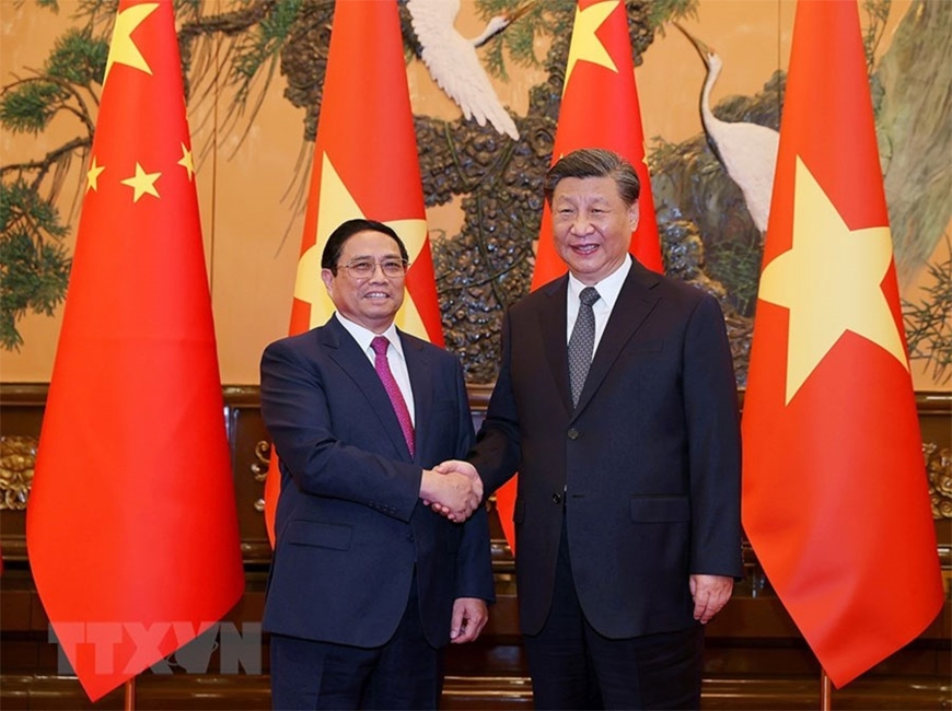Thủ tướng Phạm Minh Chính và Tổng Bí thư, Chủ tịch nước Trung Quốc Tập Cận Bình. Ảnh: TTXVN 