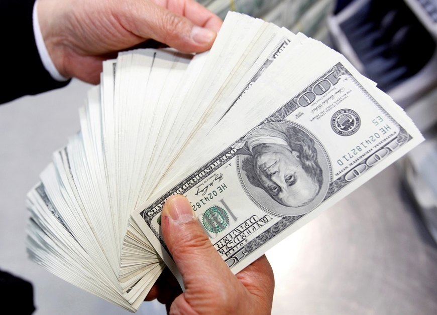Tỷ giá USD hôm nay 4-7-2023: Đồng USD tăng nhẹ. Ảnh minh họa: Reuters. 