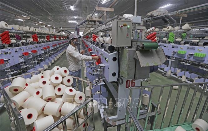 Sản xuất sợi tại Công ty TNHH Dệt Hà Nam, thành phố Phủ Lý, tỉnh Hà Nam. Ảnh minh họa: TTXVN 