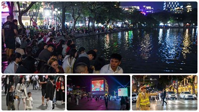 View - 	Người dân đổ về khu vực Hồ Hoàn Kiếm chuẩn bị xem pháo hoa đón chào nă