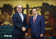 越南政府总理范明政建议卡塔尔加大与越南的能源合作