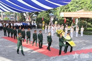 ພິທີໄວ້ອາໄລ ແລະປົງອັດຖິນັກຮົບເສຍສະຫຼະຊີວິດເພື່ອຊາດ ທີ່ເສຍສະຫຼະຊີວິດຢູ່ລາວ ຈຳນວນ 76 ອັດຖິ