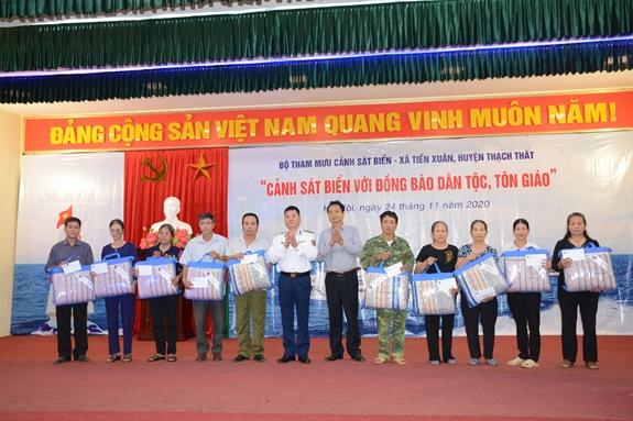 Vietnam Coast Guard stands side by side with ethnic minority people