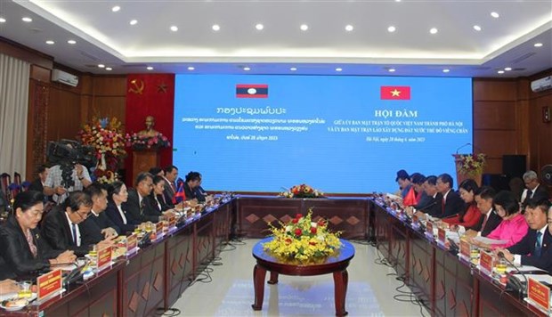 Hanoi, Vientiane fronts foster cooperation