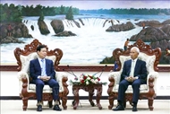 Party commissions of Vietnam, Laos strengthen cooperation in communications