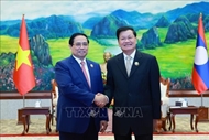 Prime Minister meets Lao Party General Secretary and President