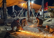 Troops work through night to build houses for flood-affected residents