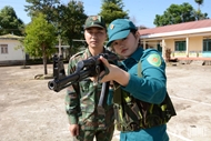 Female standing militia members by Yok R’keh mountain range